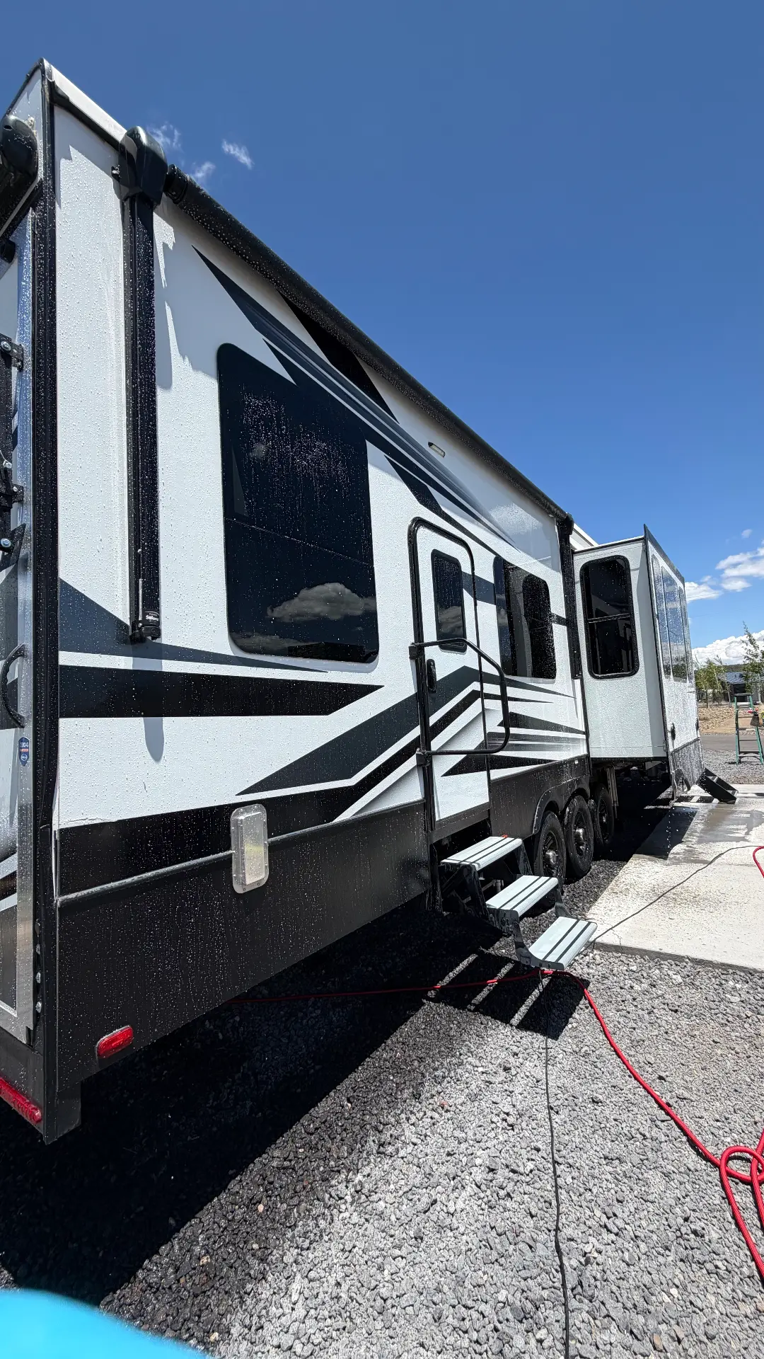 Fifth-wheel RV being washed by TK Mobile Detailing