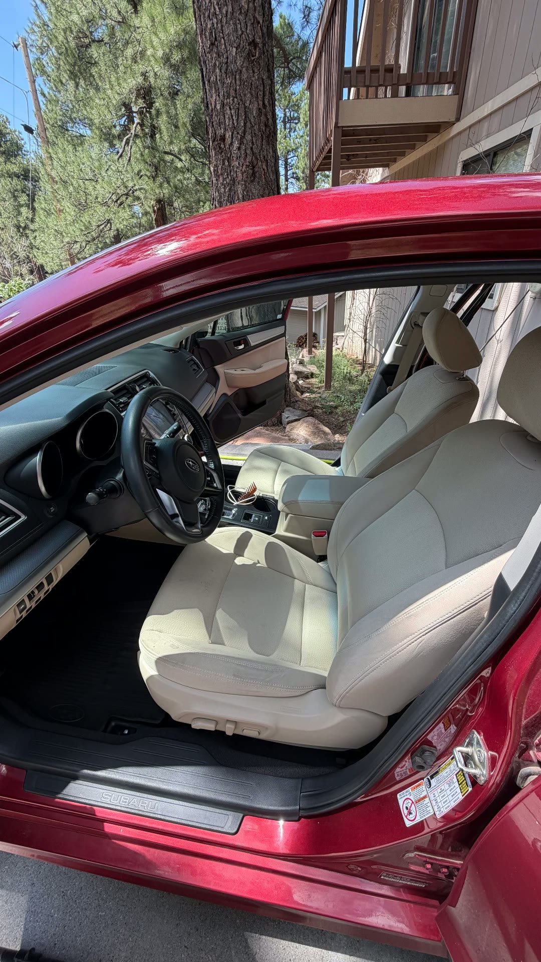 Red Subaru Legacy tan cloth front interior after detail