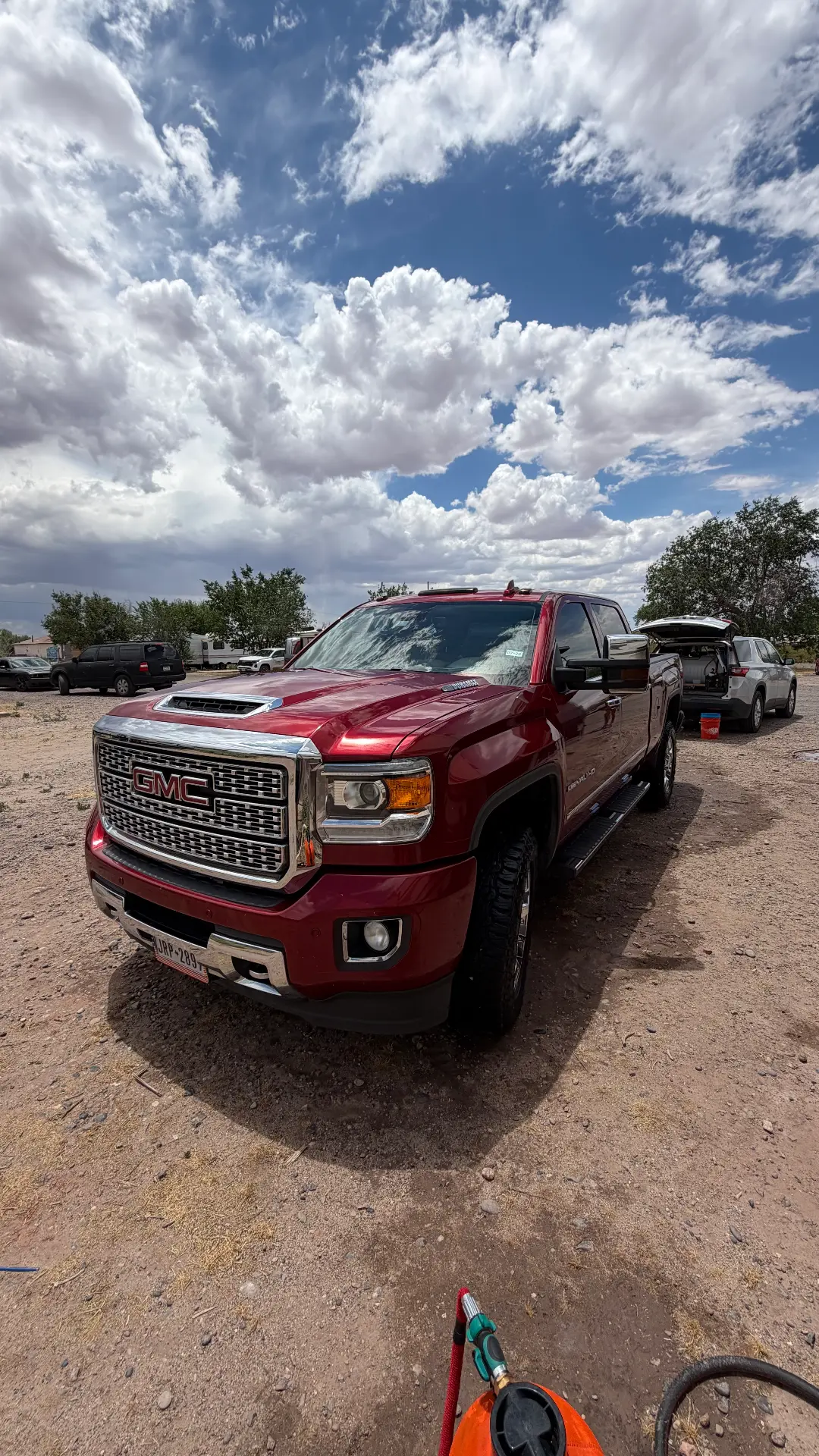 Red GMC Sierra Denali after wash