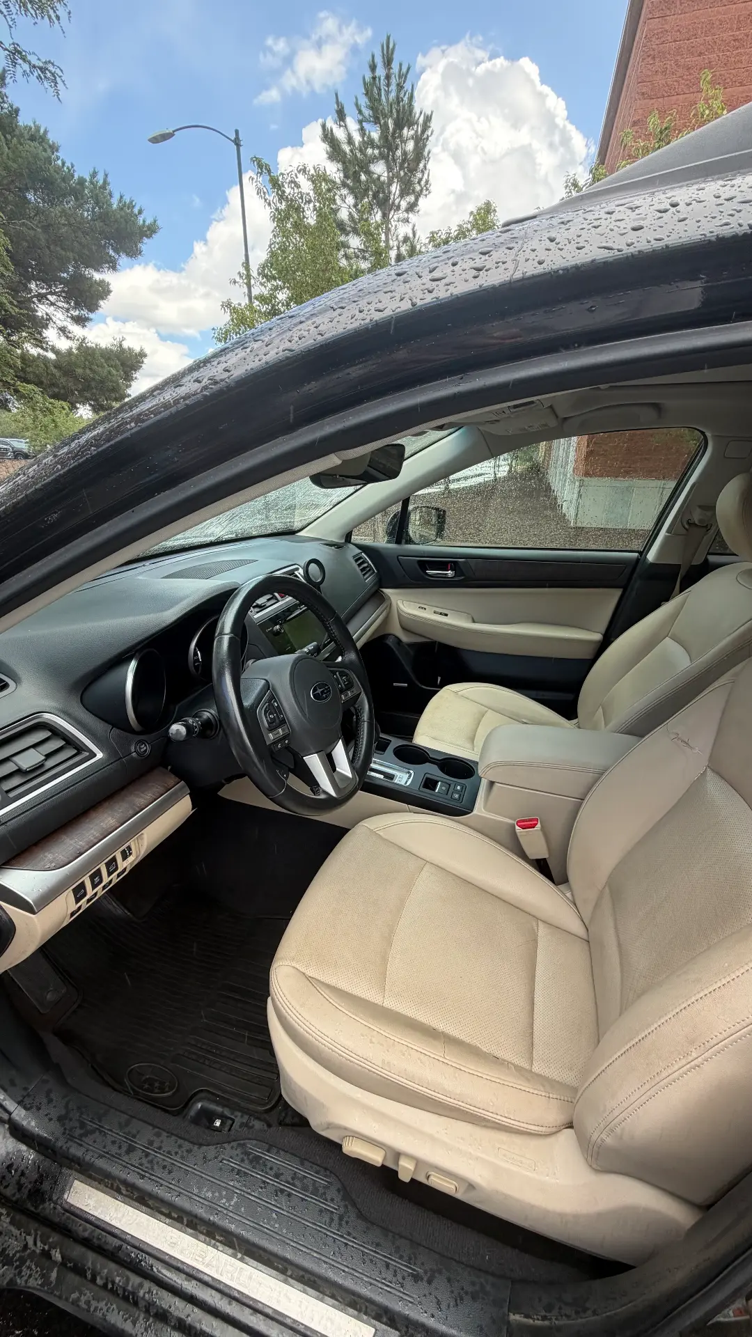 Subaru Outback ivory leather front interior after detail