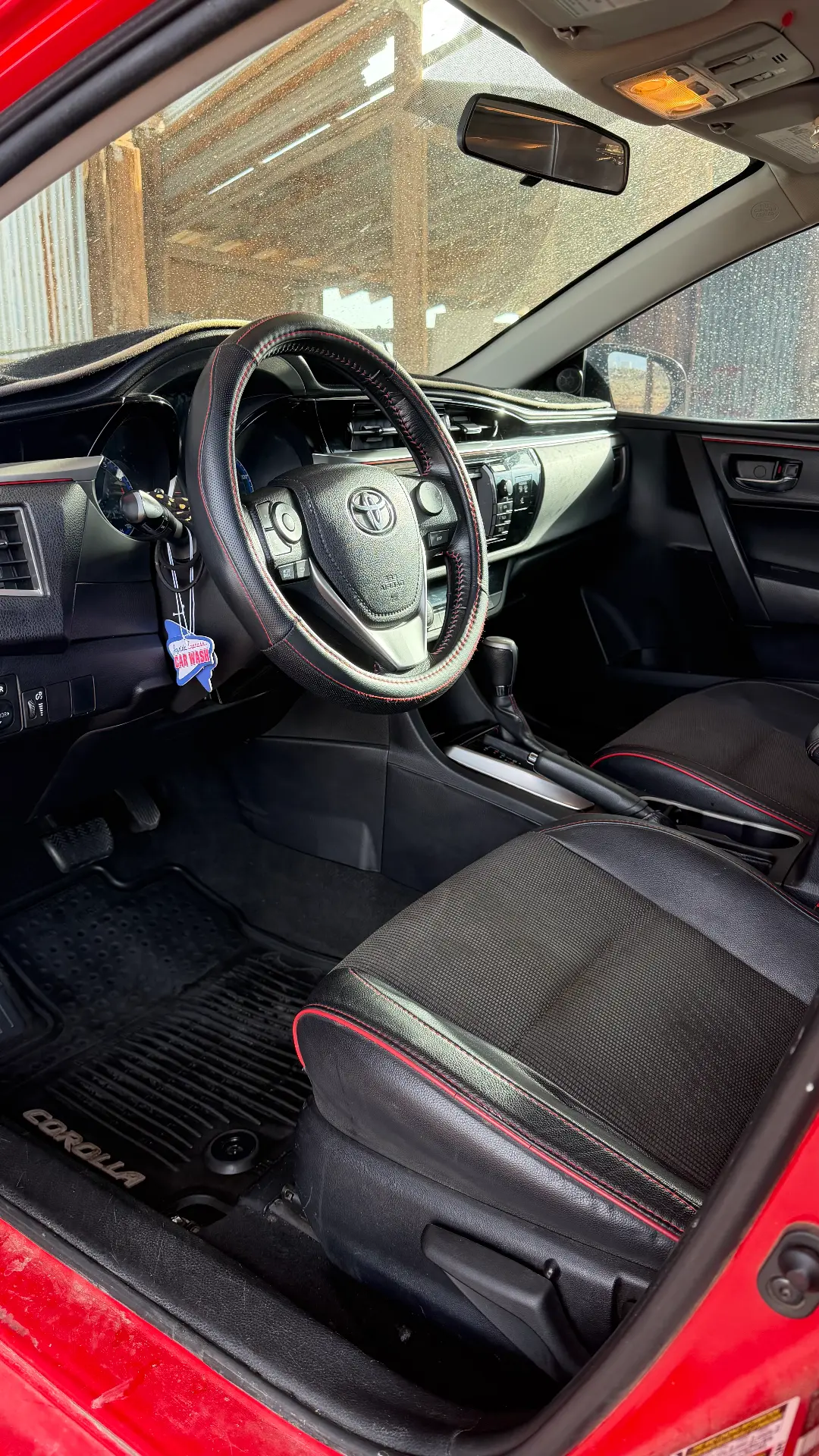 Red Toyota Corolla front interior after detail