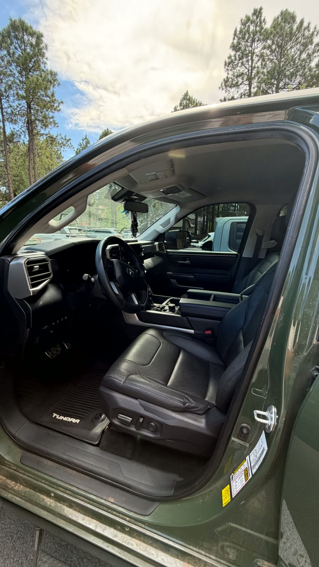 Green Toyota Tundra black leather front interior after detail