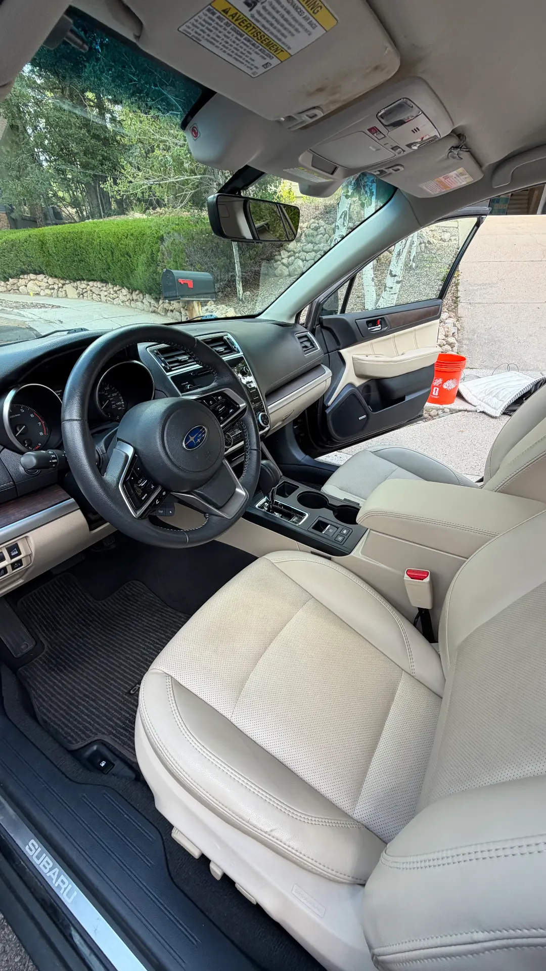 Subaru Outback ivory leather front interior after detail