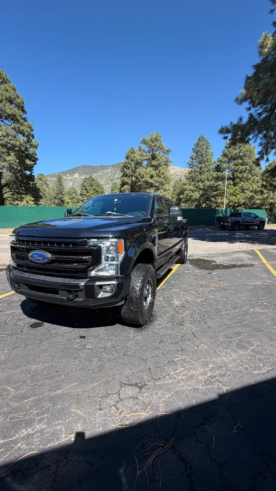 Black Ford Super Duty with mountains