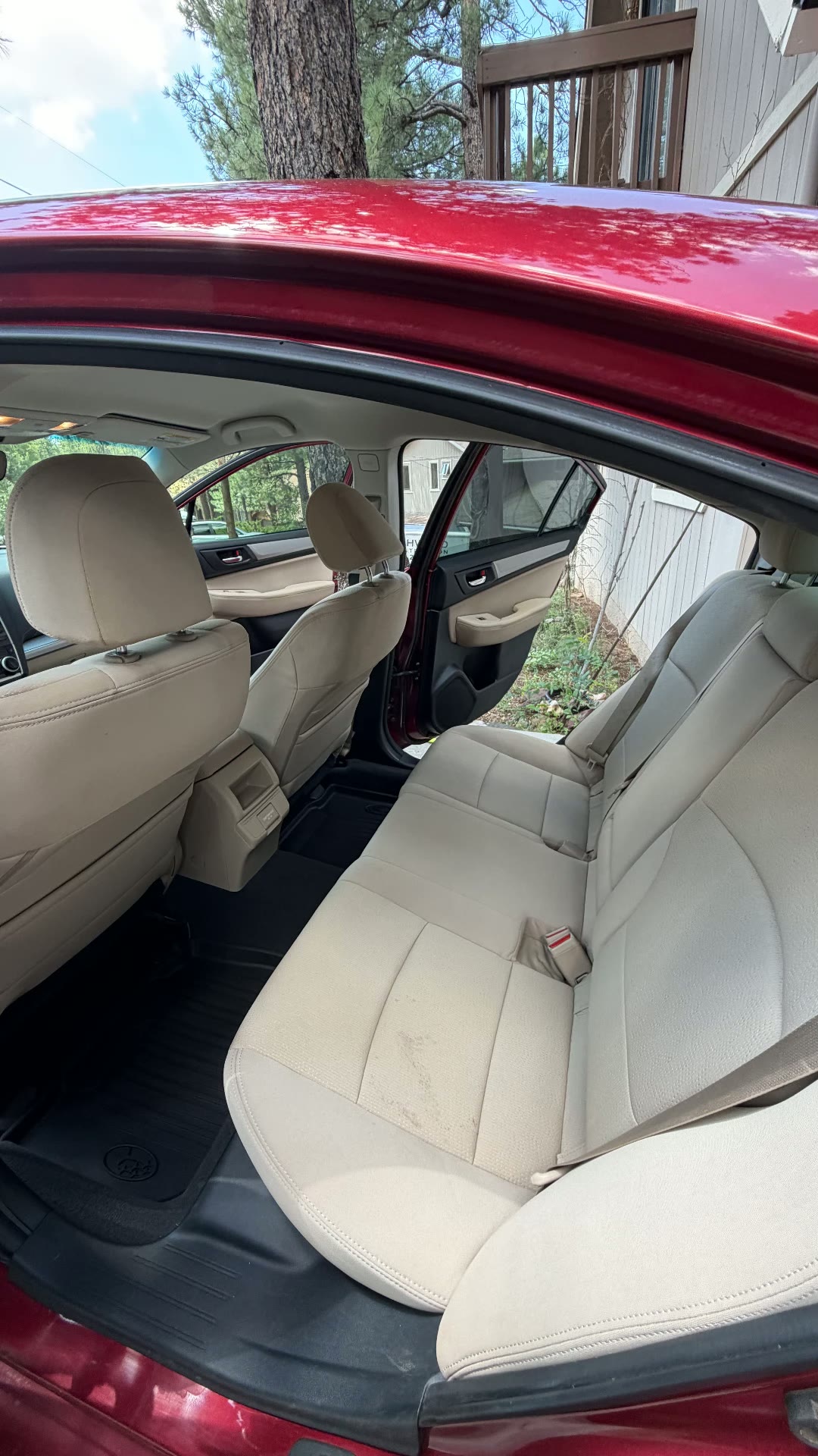 Red Subaru Legacy rear seats after detail