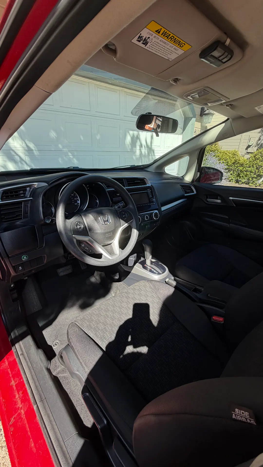 Red Honda Fit dashboard after detail