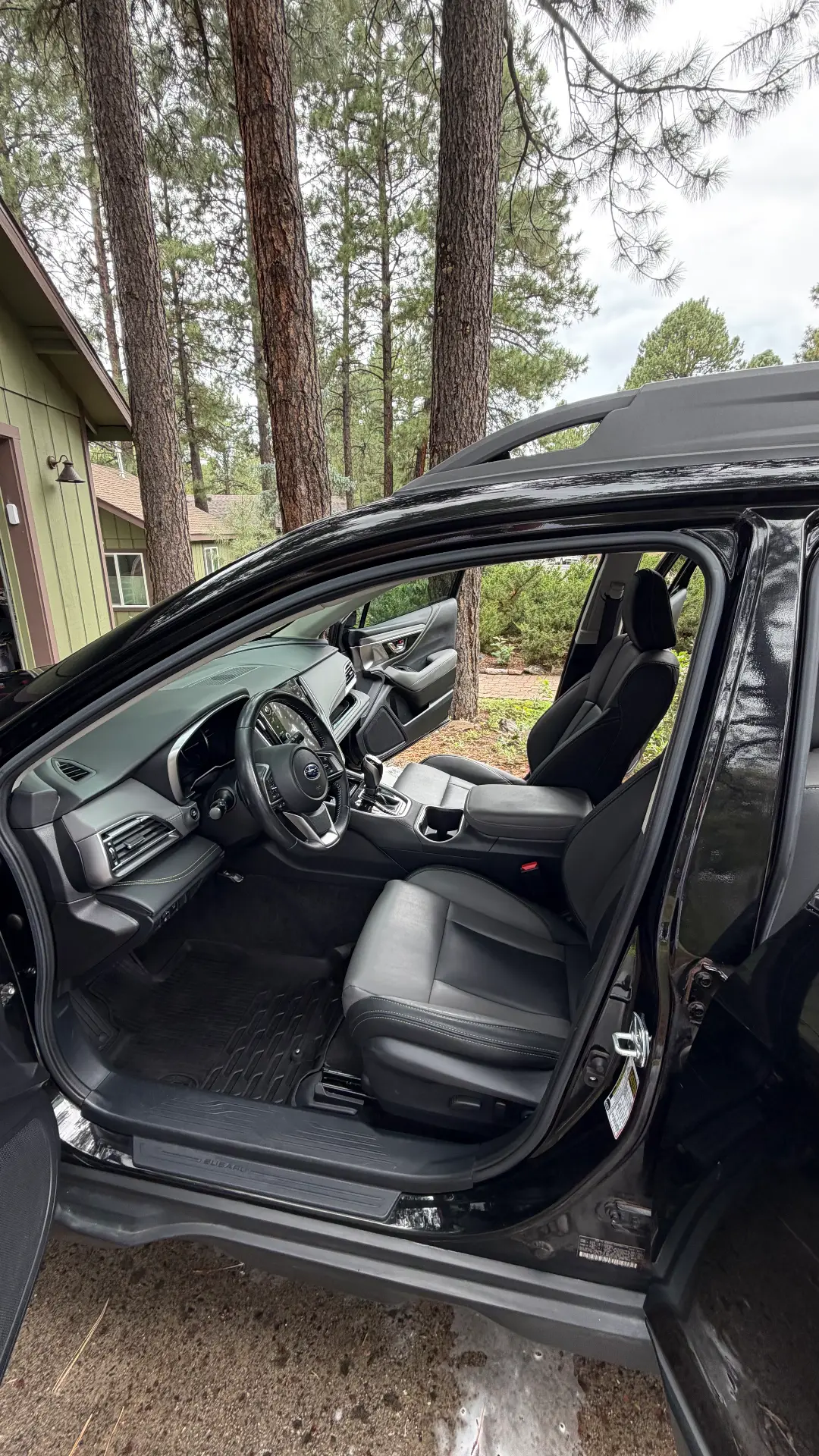 Black Subaru Outback front interior after detail