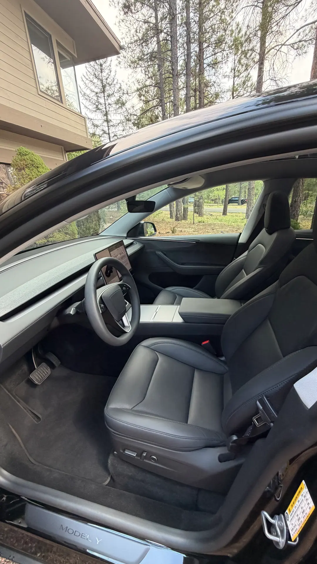 Tesla Model Y black leather front interior after detail