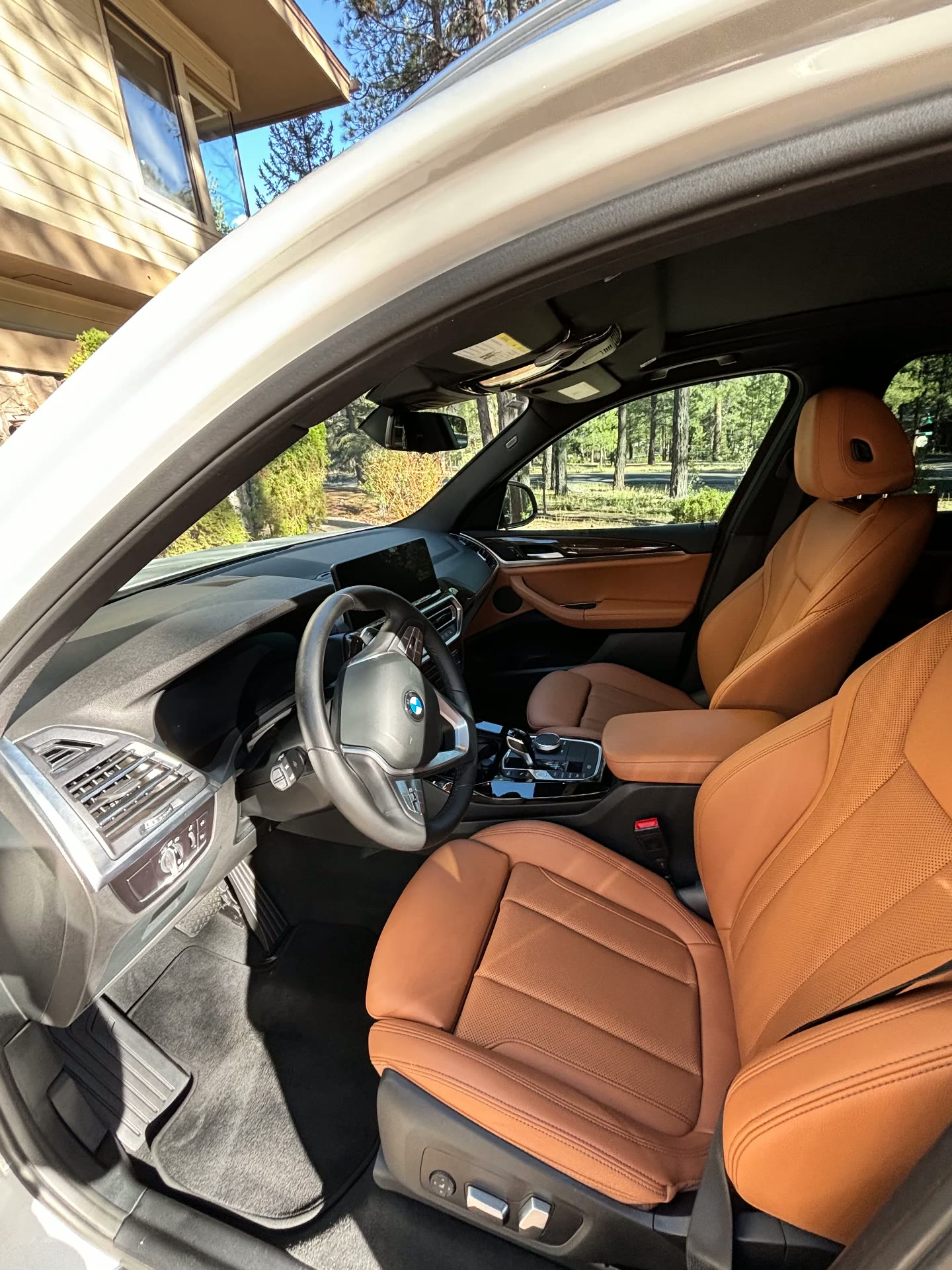 BMW X3 cognac leather front seats after detail